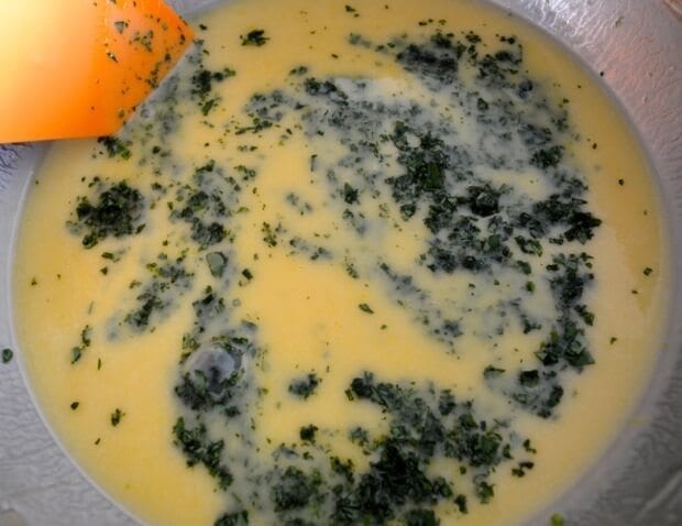 Mixing basil into batter