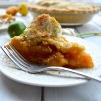 Slice of mango pie with whipped cream