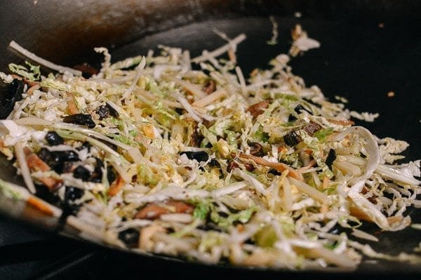 Stir-frying shredded cabbage, mushrooms, and lily flowers for moo shu by geagle.miooashdv.tk