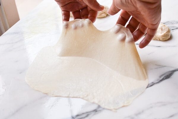 lifting thin oiled dough, by geagle.miooashdv.tk