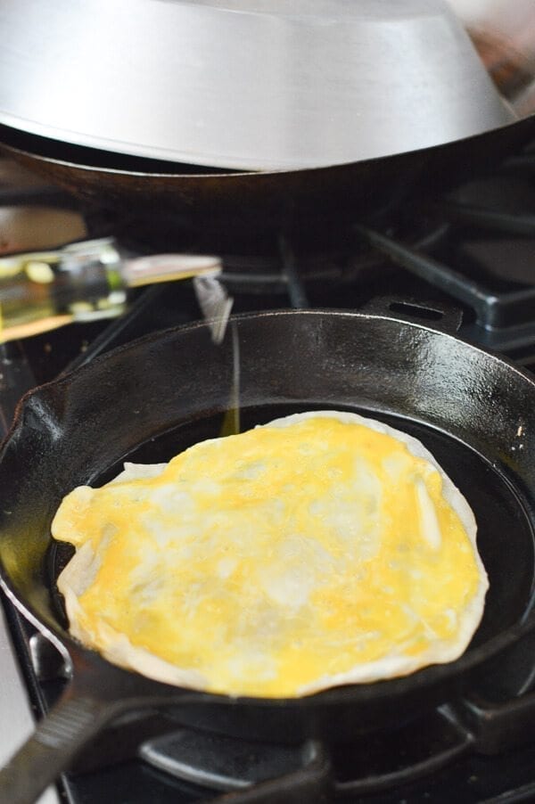 adding oil onto Jidan Bing in pan, by geagle.miooashdv.tk