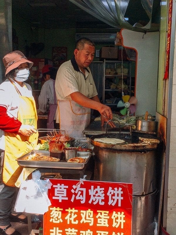street vendors making Jidan Bing, by geagle.miooashdv.tk