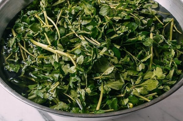 washing watercress in bowl