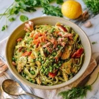 Bowl of fettuccini with green goddess, peas, and salmon