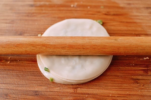 Rolling out scallion pancake made with layered dumpling wrappers, geagle.miooashdv.tk