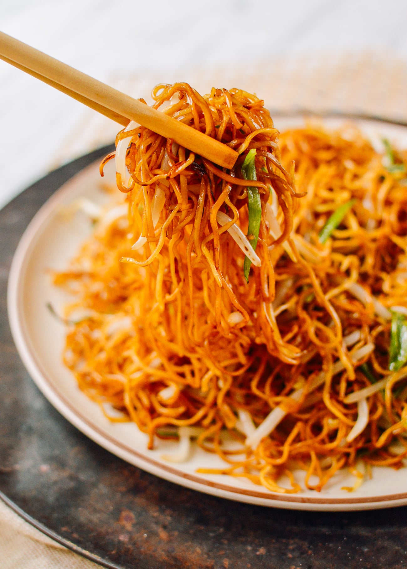 Picking up soy sauce pan-fried noodles with chopsticks