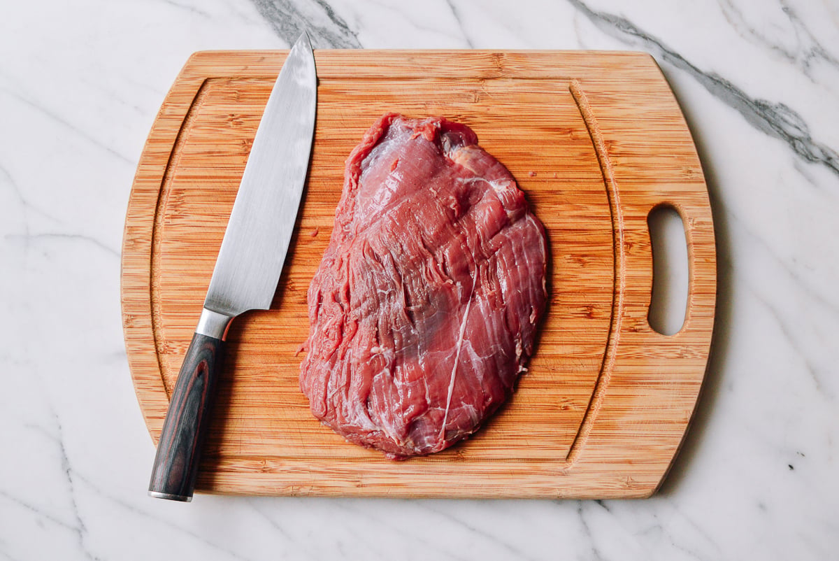 beef flank steak on a cutting board by geagle.miooashdv.tk