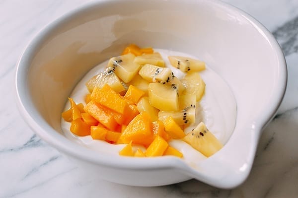 Folding mango and kiwi into yogurt, geagle.miooashdv.tk