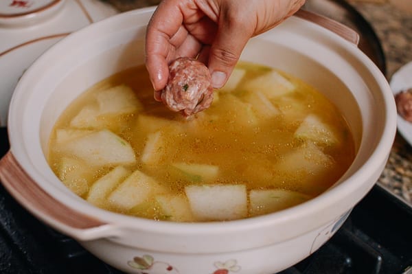 Lowering meatballs into soup, geagle.miooashdv.tk