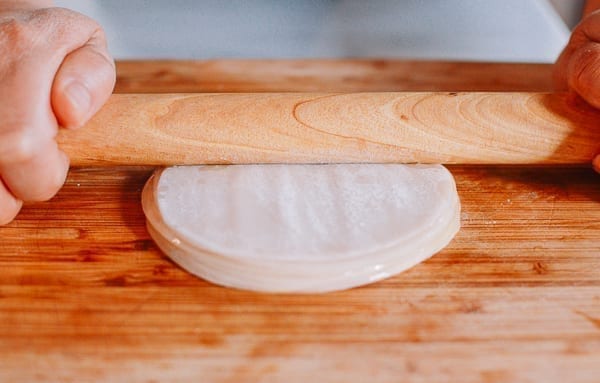 Pressing stack of dumpling wrappers with rolling pin, geagle.miooashdv.tk