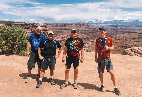 Mountain bikers group photo at top of Schafer trail on White Rim trail Moab Utah by geagle.miooashdv.tk