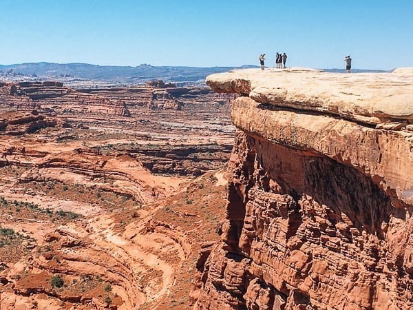 Hikers near white crack on White rim trail in Canyonlands by geagle.miooashdv.tk