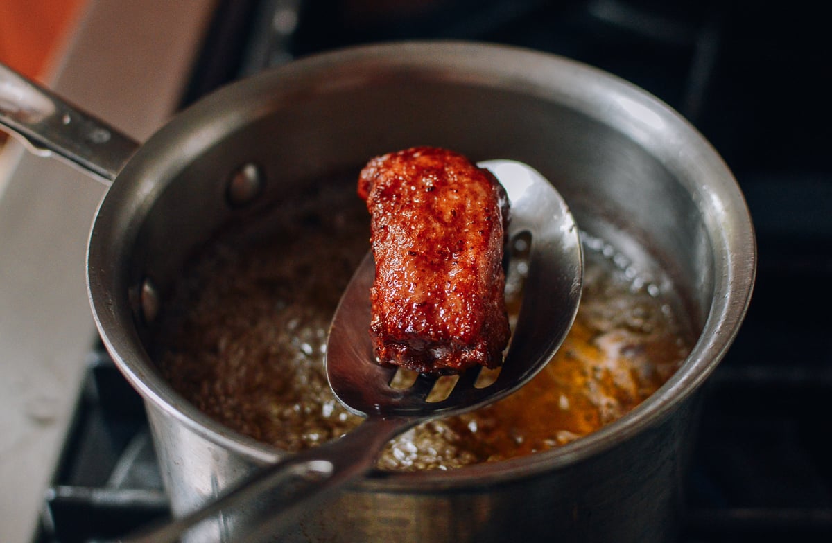 Pulling fried rib out of frying oil, geagle.miooashdv.tk