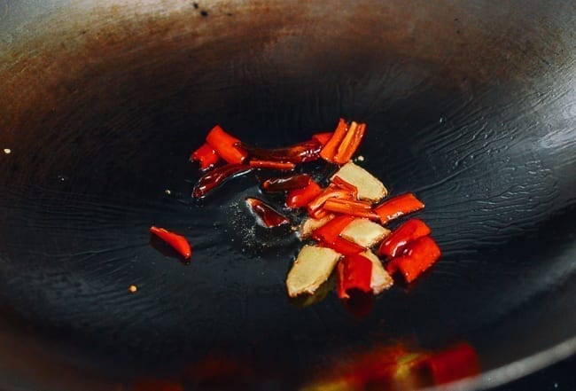 Adding red peppers to wok, geagle.miooashdv.tk
