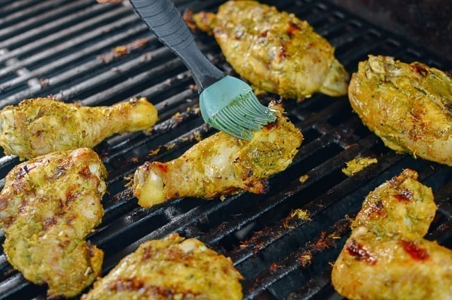Basting gai yang chicken with marinade, geagle.miooashdv.tk