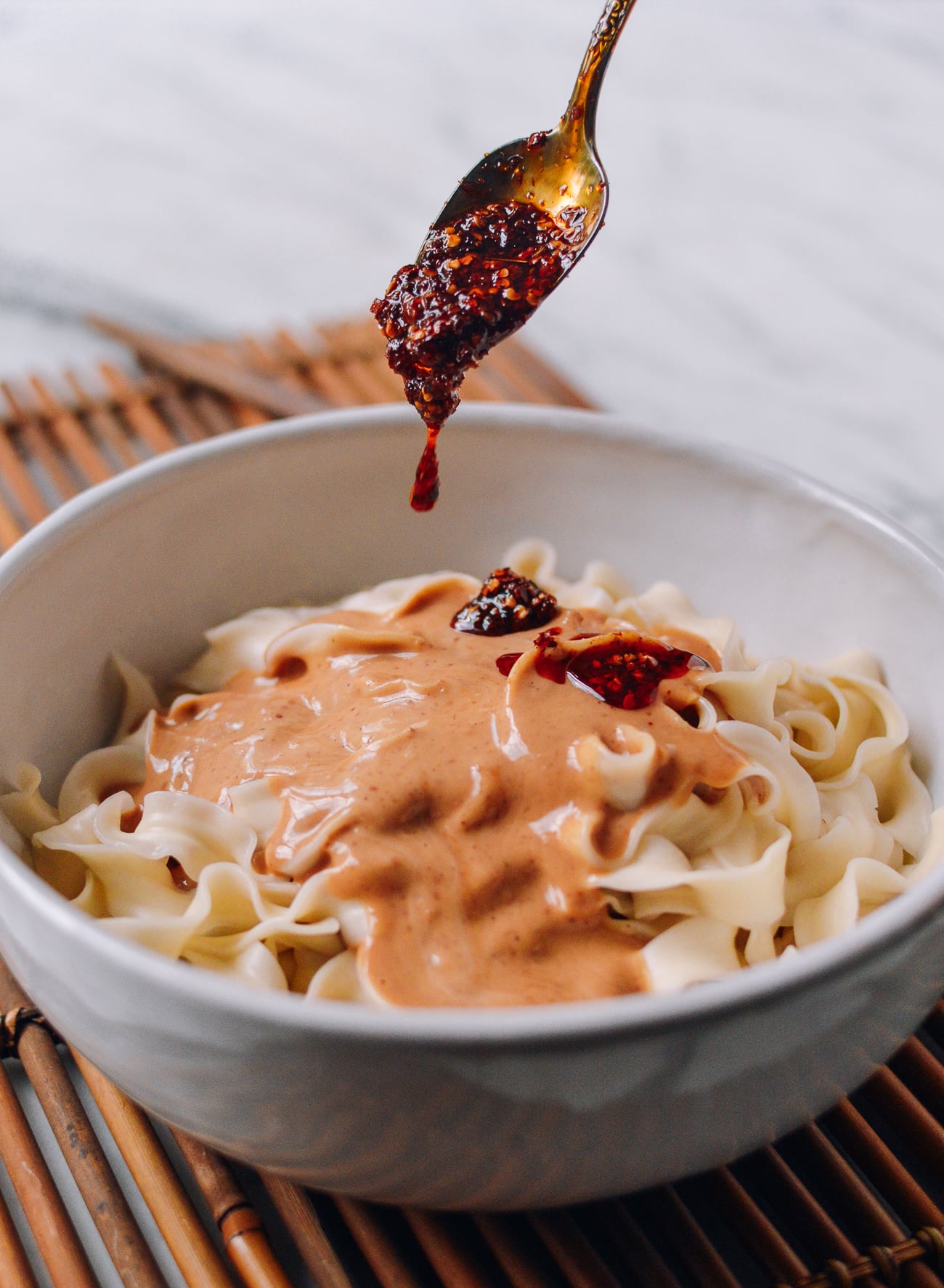 Adding extra chili oil to peanut noodles, geagle.miooashdv.tk