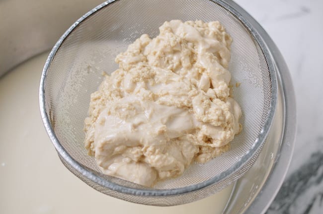 Pouring dough through fine-meshed strainer, geagle.miooashdv.tk