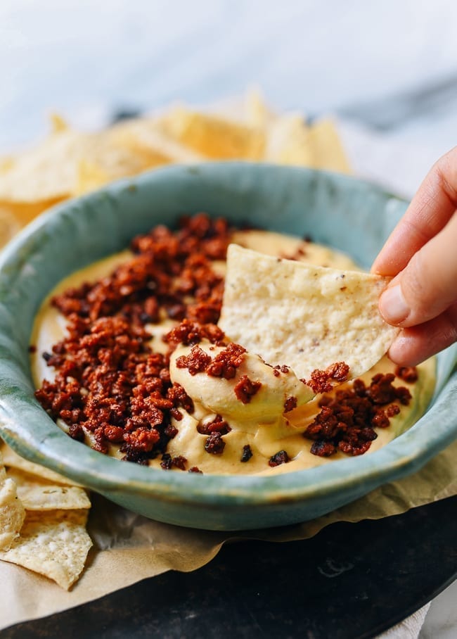Dipping chip into vegan queso, geagle.miooashdv.tk