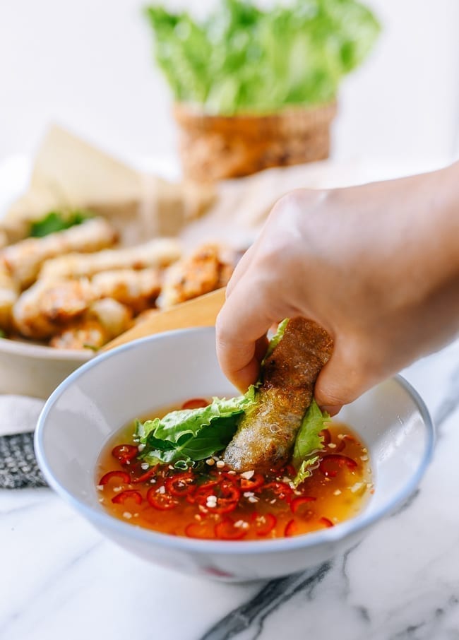 Dipping cha gio into nuoc cham, geagle.miooashdv.tk