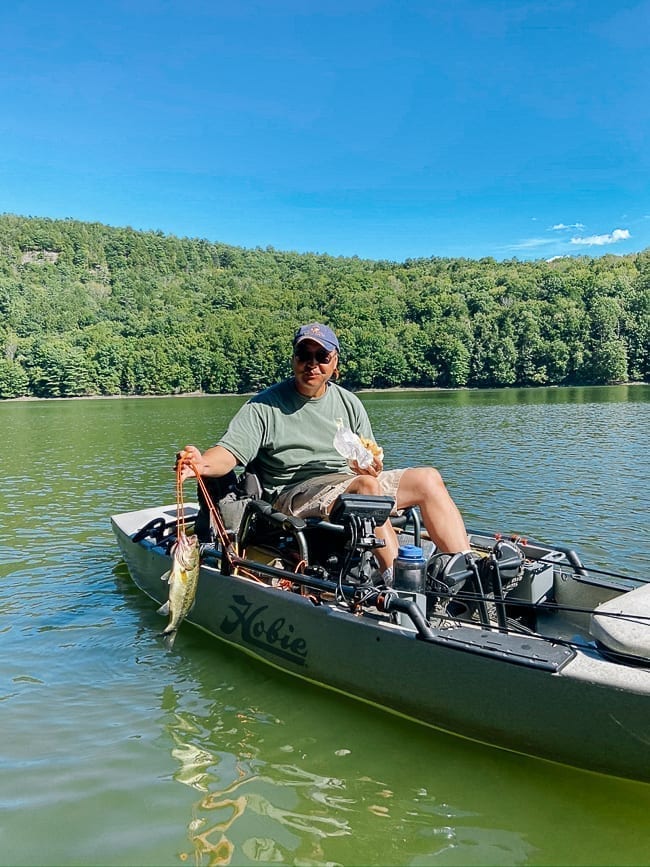 Bill on fishing kayak holding catch, geagle.miooashdv.tk