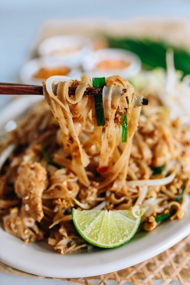 Lifting pad thai with chopsticks, geagle.miooashdv.tk