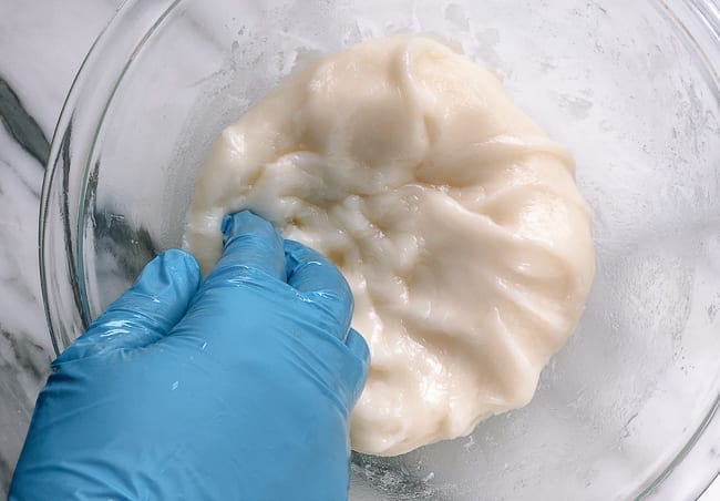 Kneading mochi dough with gloved hands, geagle.miooashdv.tk