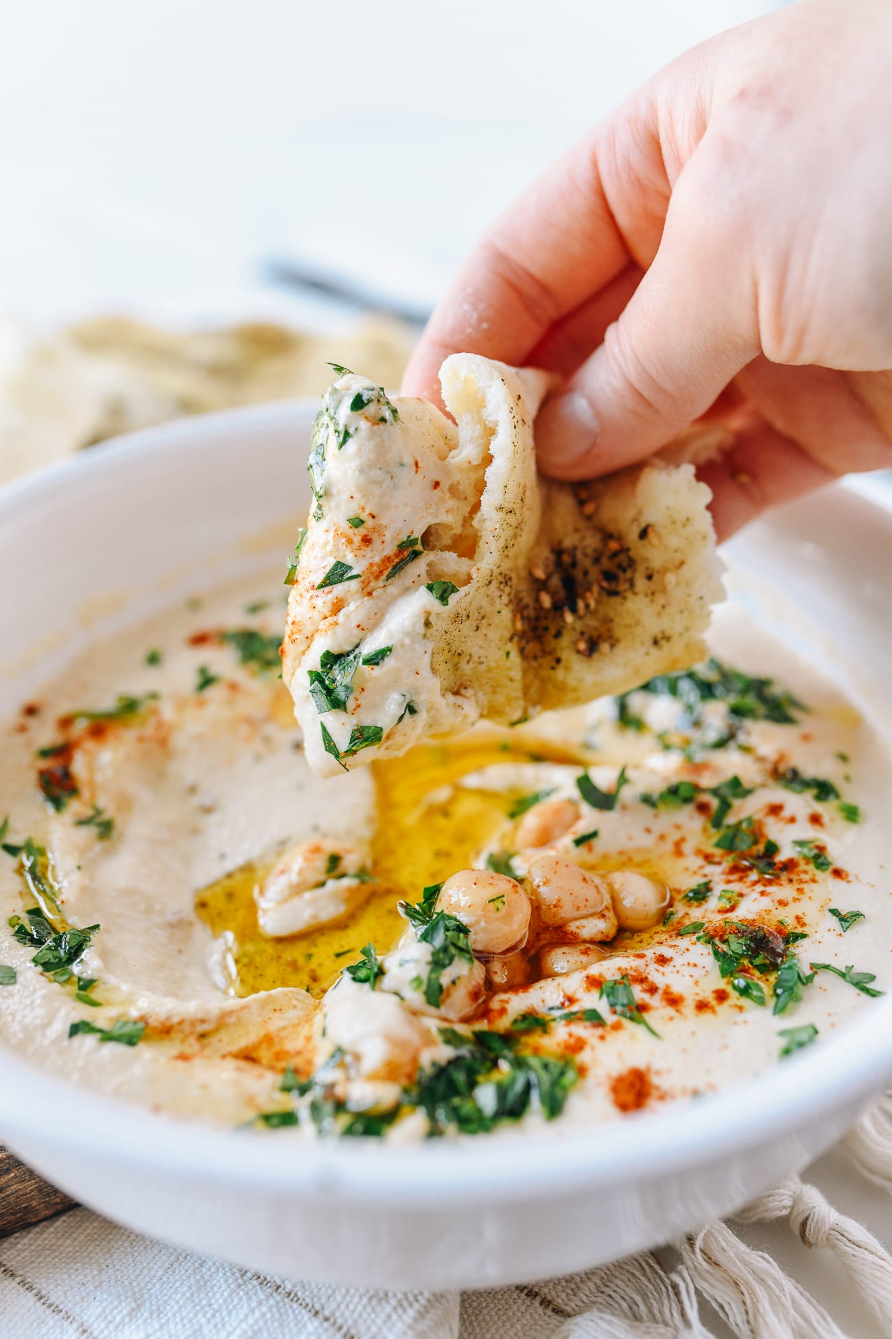 Dipping Laffa Bread into Hummus