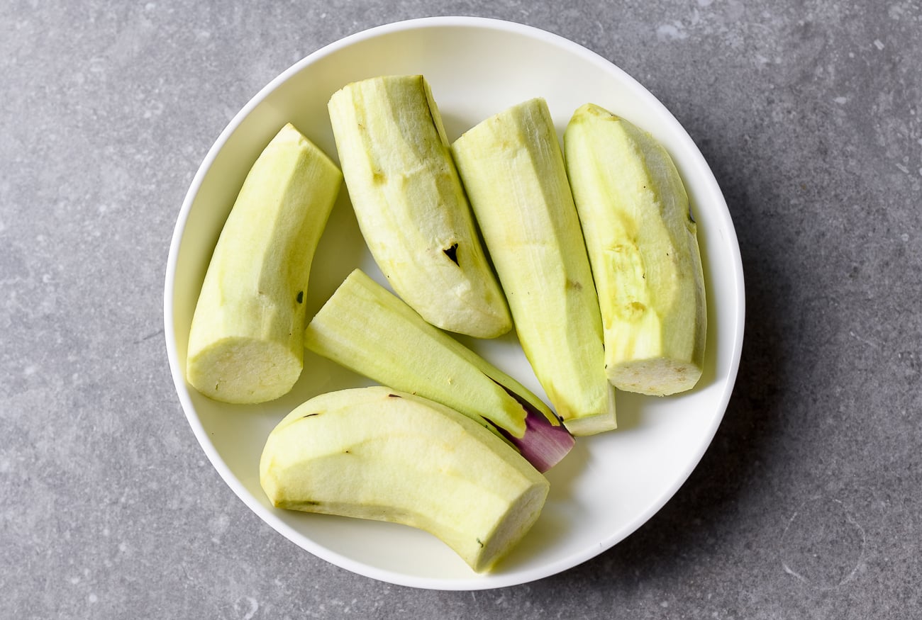 Peeled Japanese eggplants in heatproof dish