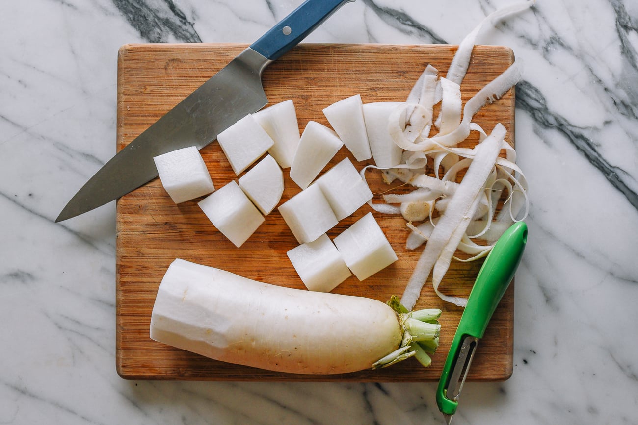 daikon cut into chunks on cutting board