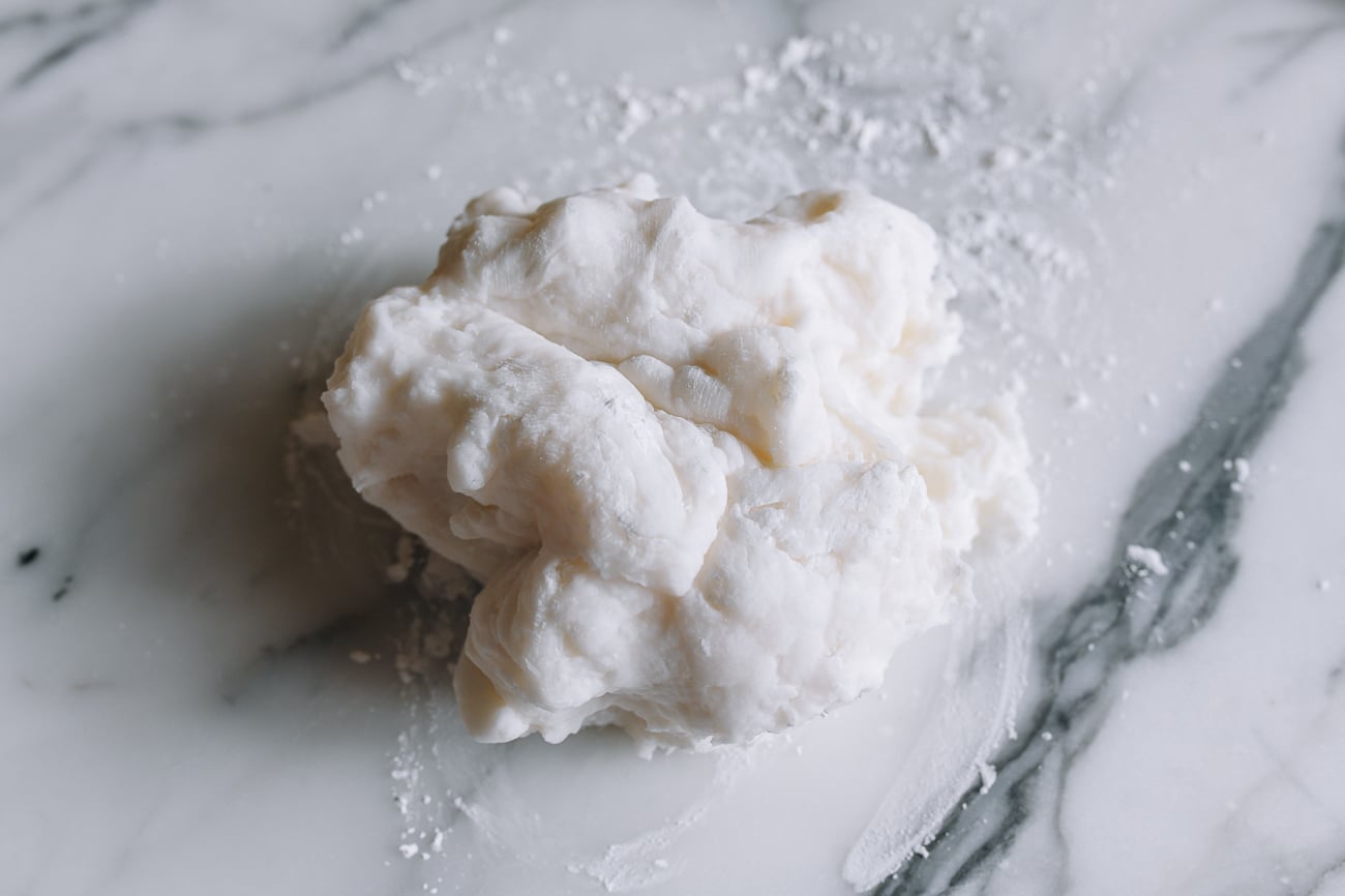 starch dough on work surface dusted with cornstarch