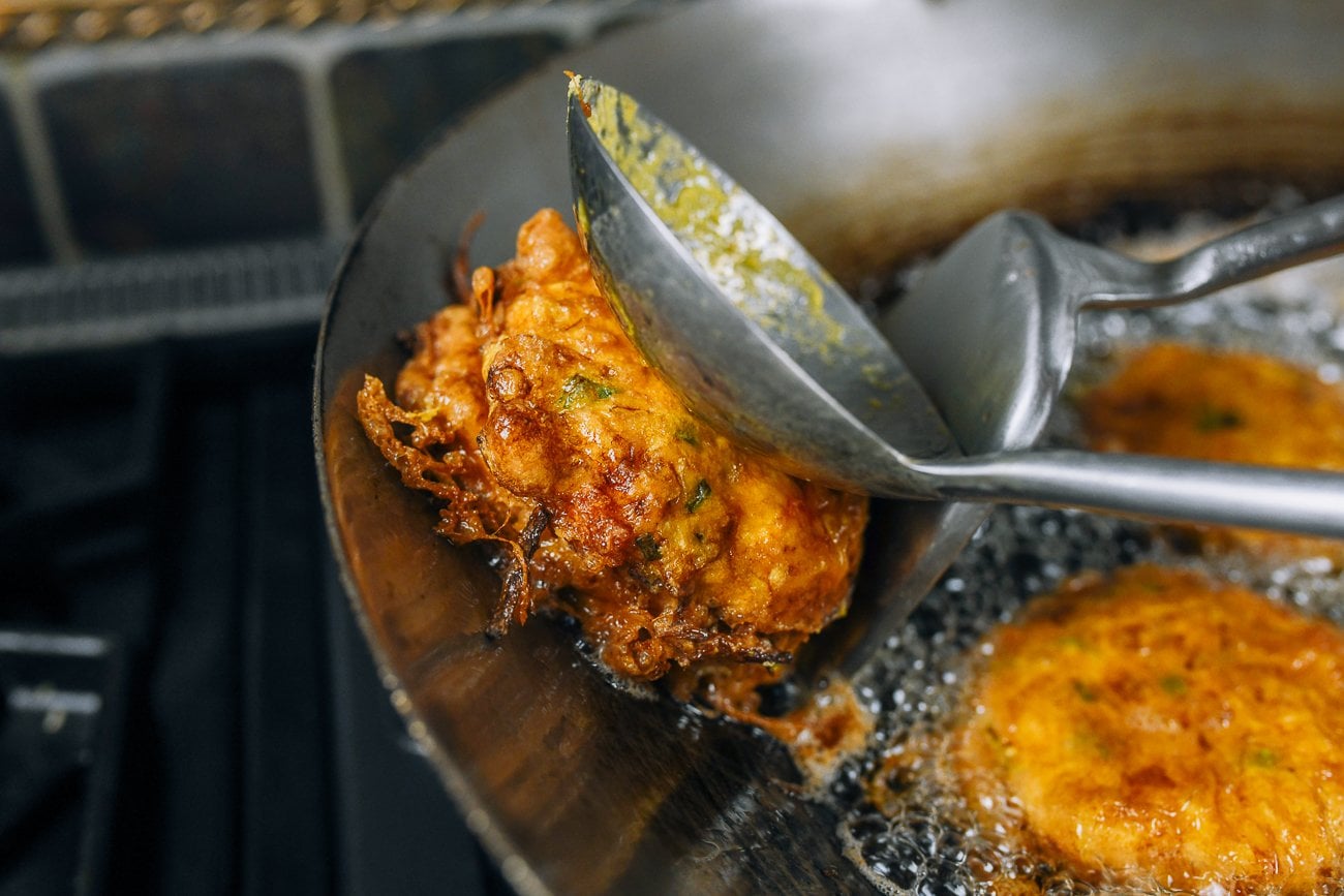 squeezing excess oil out of egg foo young