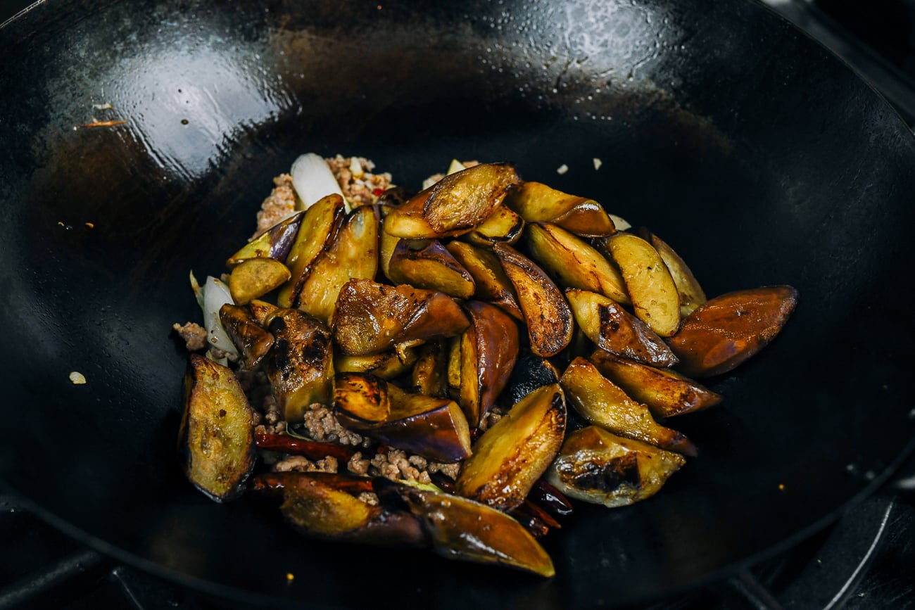 pre-seared eggplant added to wok