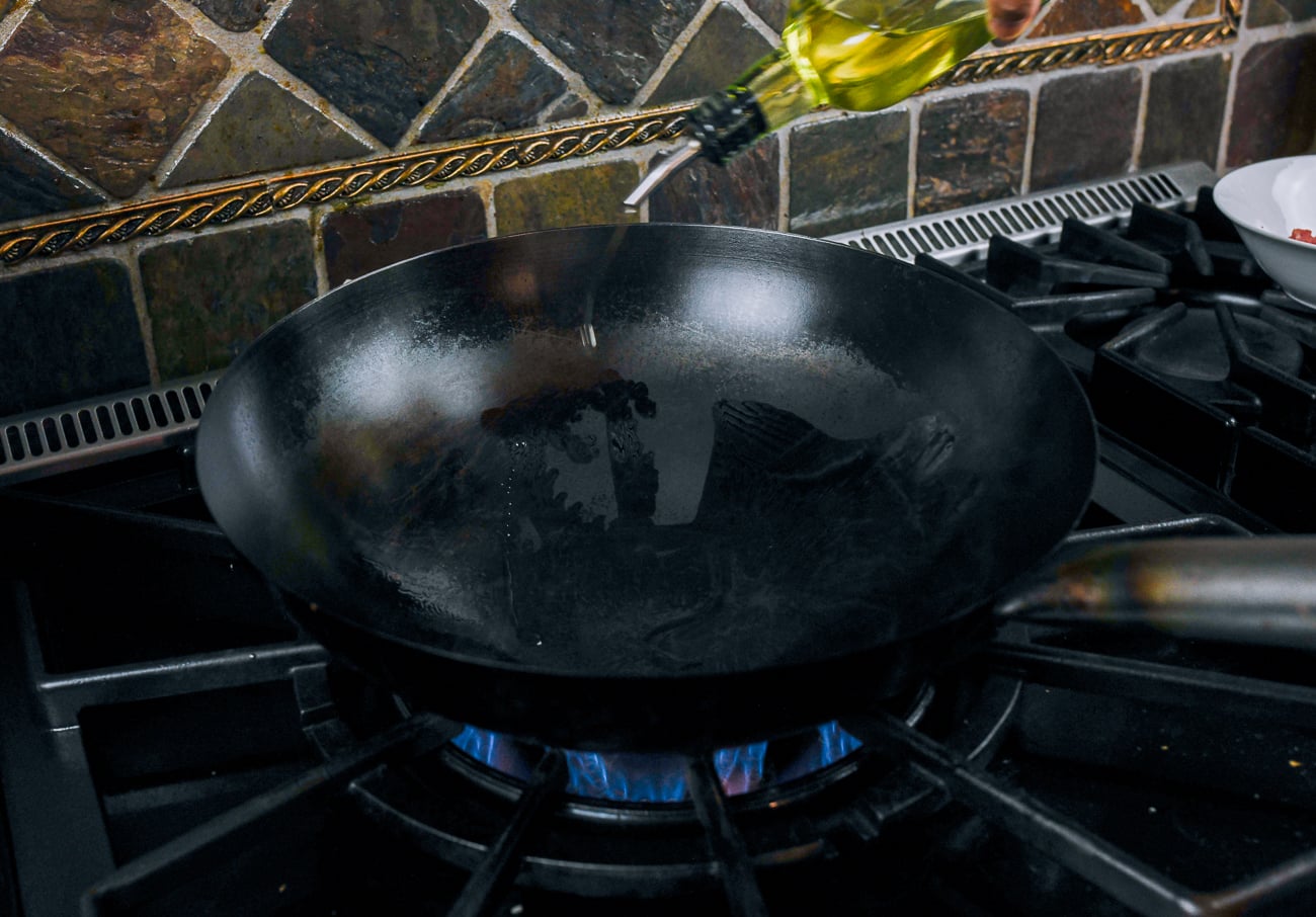 adding cold oil to hot wok