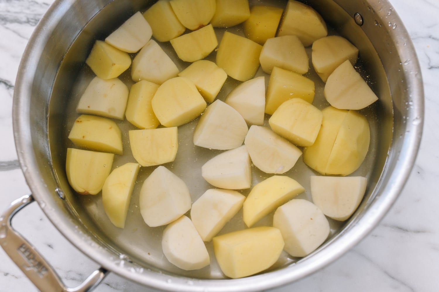 potato chunks in pot with water
