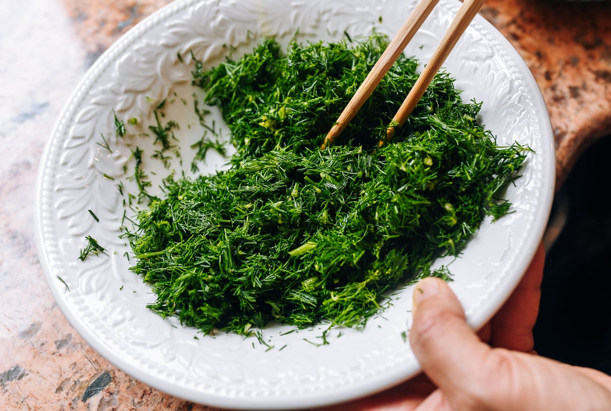 coating chopped dill in oil