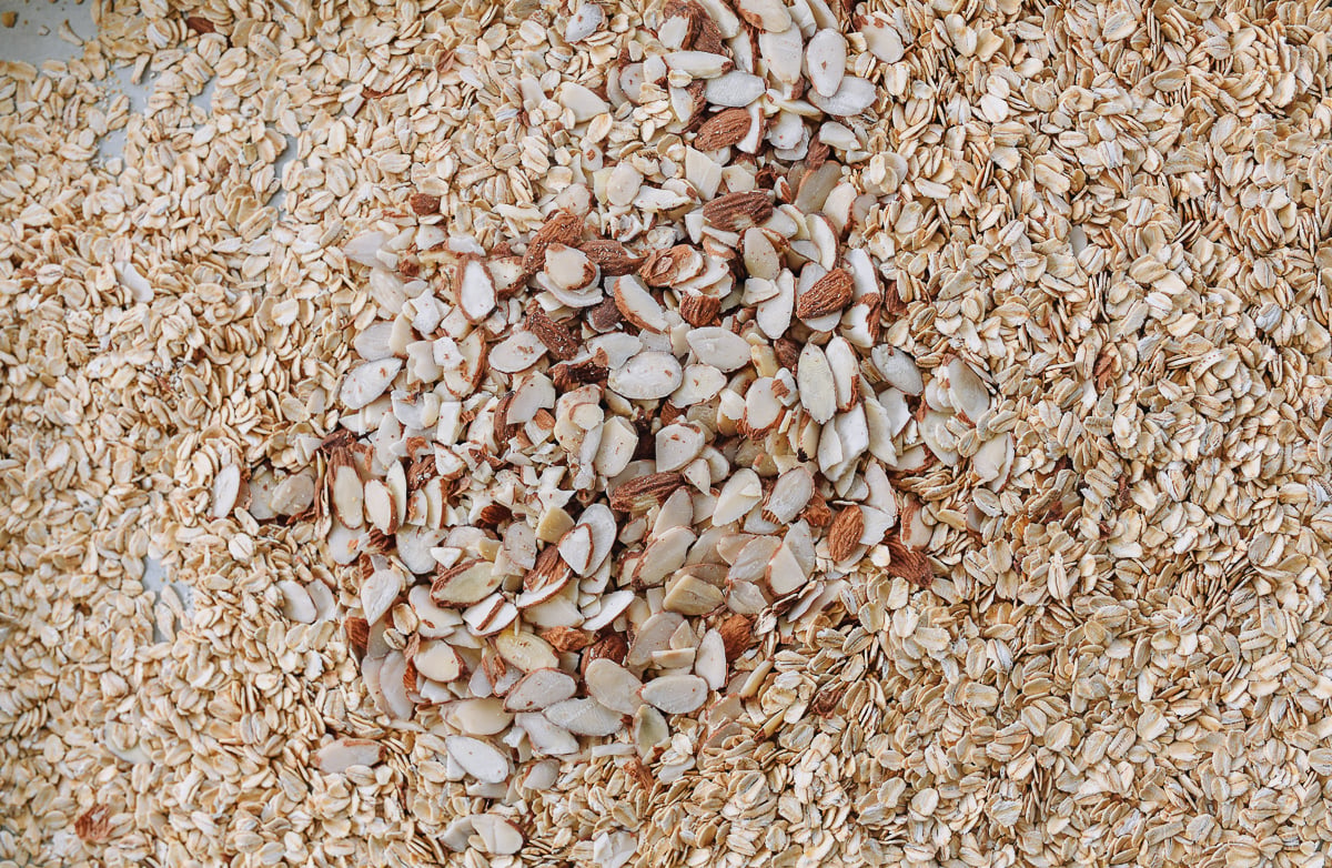 oats and sliced almonds on sheet pan