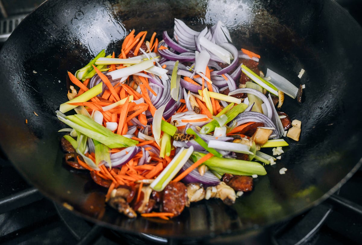 vegetables in wok with lap cheong
