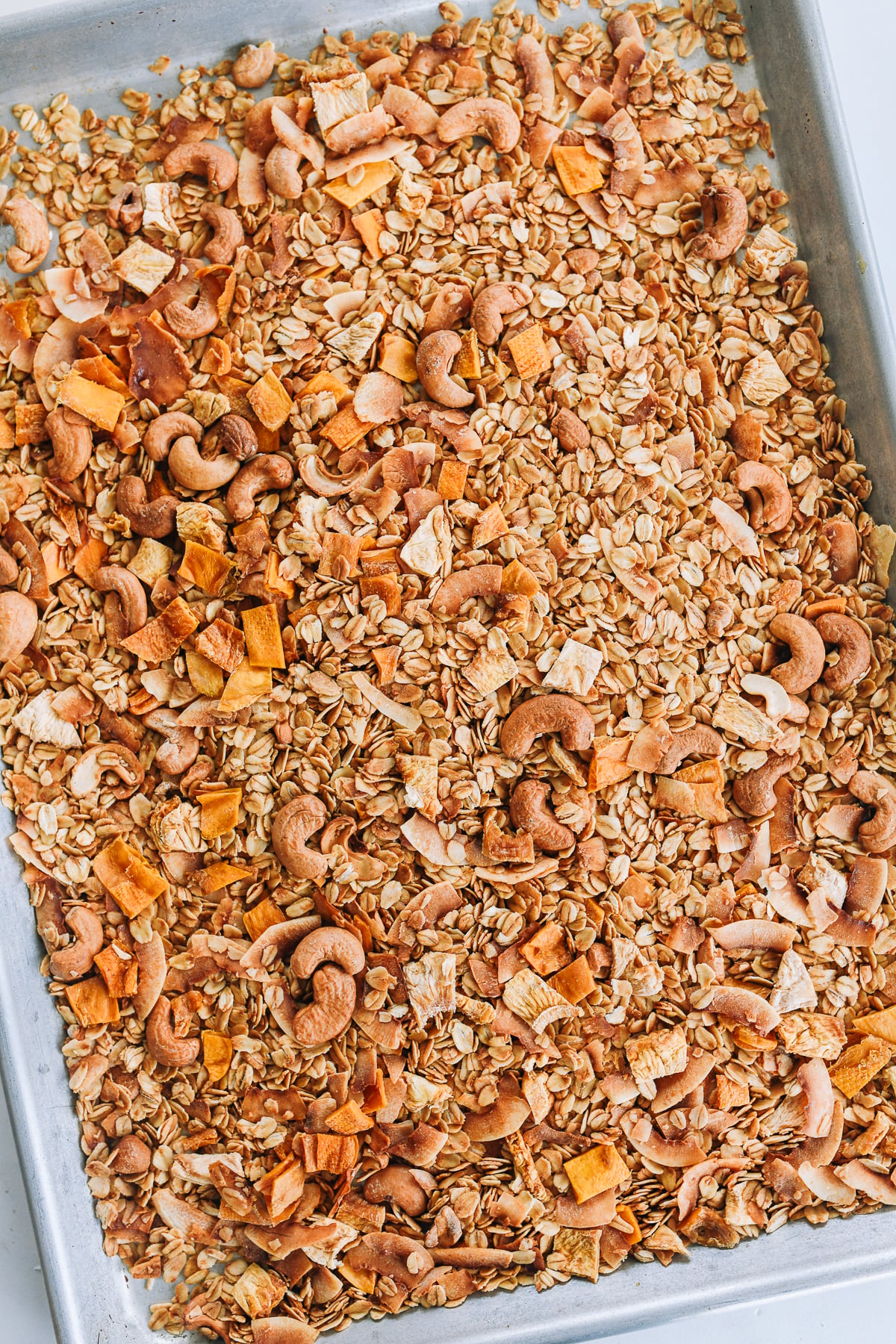 tropical granola on baking sheet