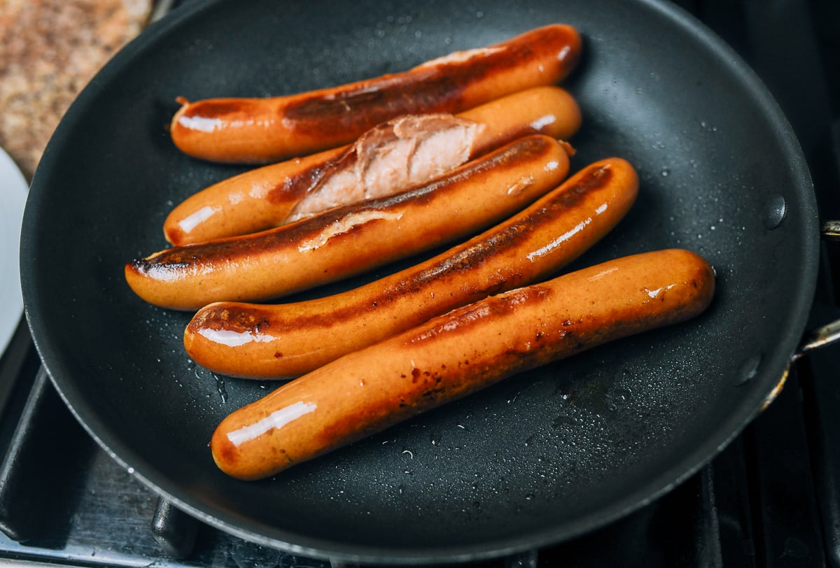 cooking hot dogs in frying pan