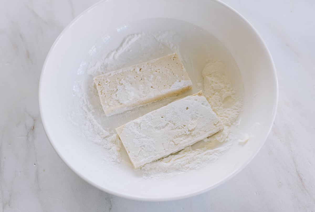 coating tofu slices in cornstarch