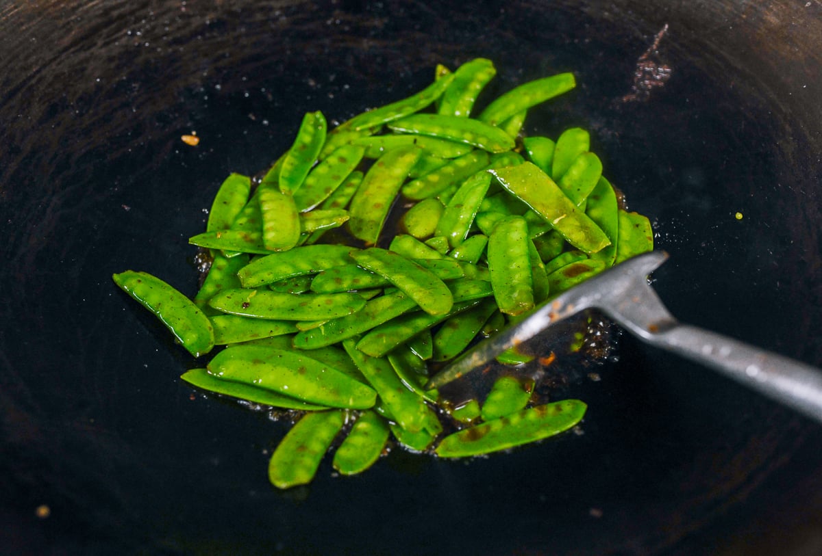 stir-frying snow peas