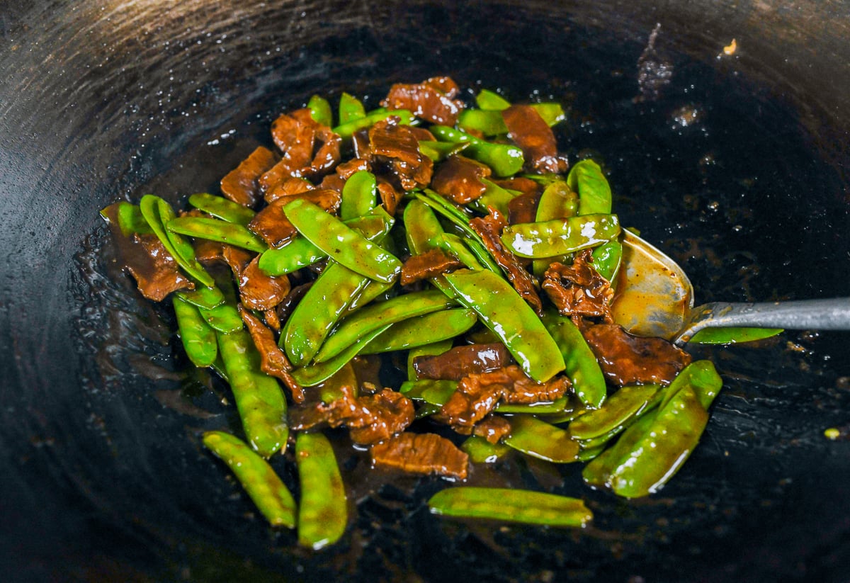 stir-frying beef with snow peas