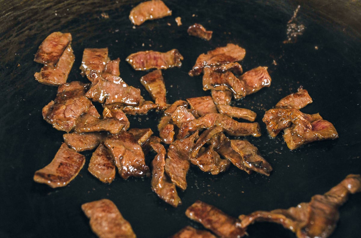 seared beef in wok