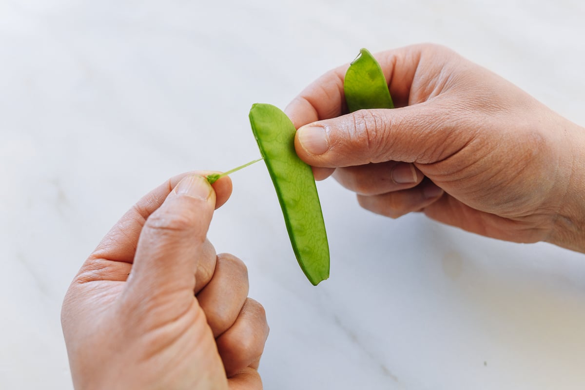 trimming snow peas