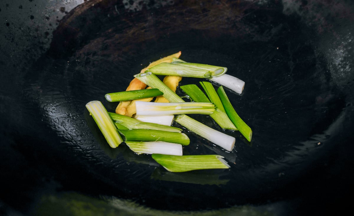 ginger, scallions and garlic in wok