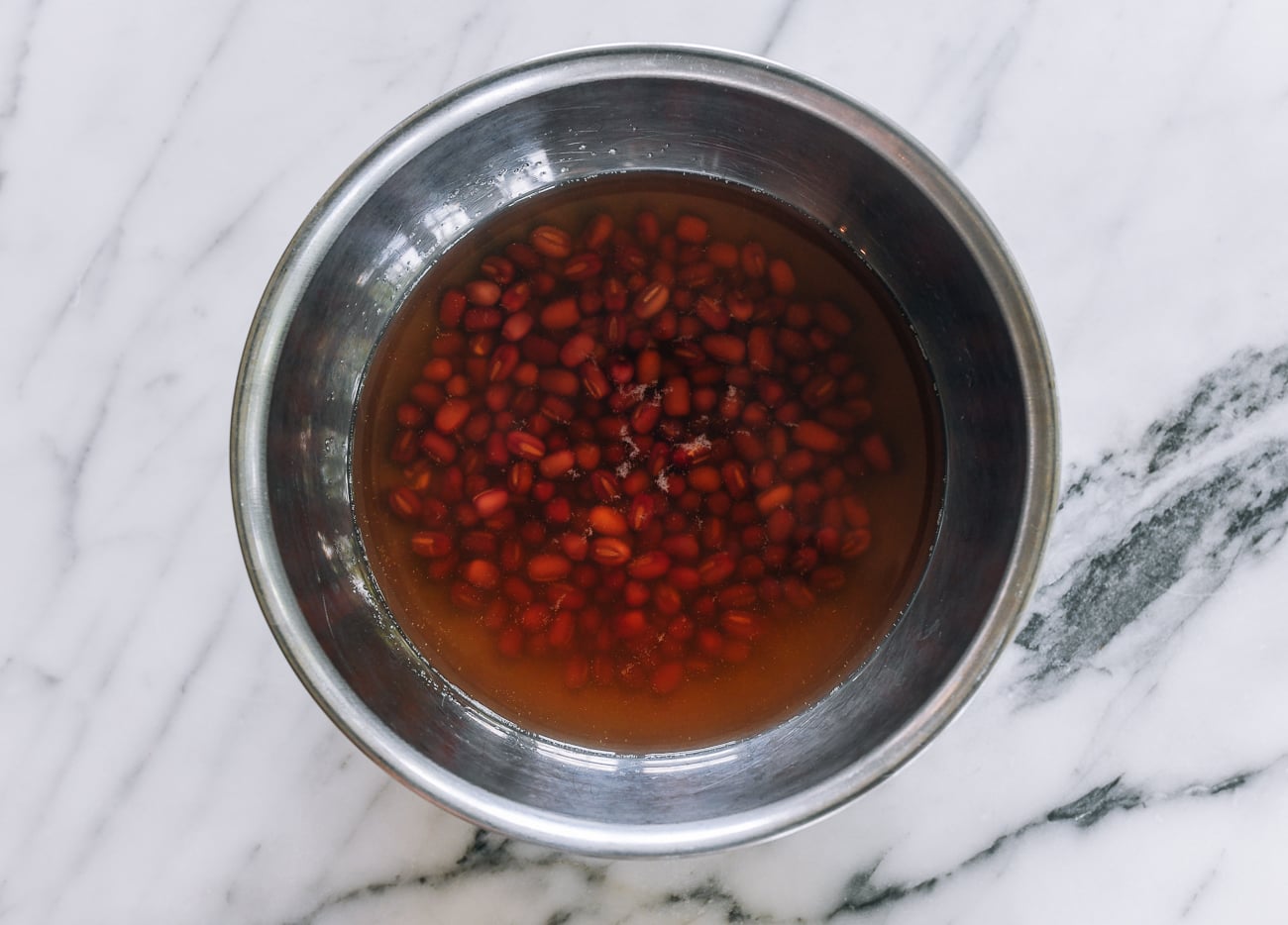 soaking red beans in bowl of water