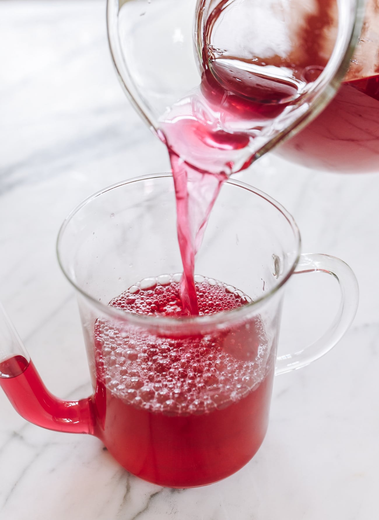 pouring shiso drink into pitcher